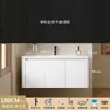 Tocador de baño engrosado y ahorrador de espacio con diseño en color crema, que cuenta con un lavabo redondeado, lavabo cerámico integrado y un lavabo de una sola pieza.