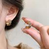 Pendientes de borlas de lujo con diseño de lazo de alta gama para mujer, elegantes pendientes de aleación explosiva con tachuelas para primavera y verano 2025.