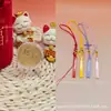 Colgante de moneda pequeña de oro puro 999 "Flor del Dinero" serie de llaveros de cuero con cordón, un regalo promocional para tiendas de oro