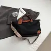 Bolsa Nueva de Mujer Otoño 2025 Impermeable Bolsa Dumpling Bolso de Mano para Viajes Diarios Gran Capacidad Bolso de Hombro Bolso de Viaje para Exteriores Portátil