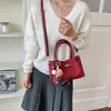Bolso de mano de alta gama de nicho para mujer, nuevo otoño 2026, súper popular, vintage, para el trabajo, de hombro y cruzado, tipo cubo