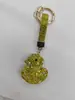 Chaveiro de liga metálica de patinho amarelo com tachinhas de argila para comércio exterior transfronteiriço, patinho fofo com strass, pingente requintado para bolsa feminina