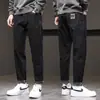 Jeans masculino cropped de alta qualidade de Hong Kong, novo tendência outono 2026, calça casual solta de perna reta elástica afunilada