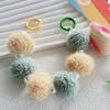 Otoño e Invierno nuevo pompón de piel con cuentas de perlas cadena portátil adornos de bolso funda para teléfono móvil cadena colgante cadena corta para muñeca para mujer