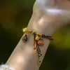 Cuerda de mano de reencarnación estilo nacional para hacer fortuna año de esta vida cuerda roja bestia devoradora de oro cuerda de mano nueva china cuerda festival del bote del dragón cuerda colorida