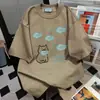 Camiseta Divertida com Estampa de Peixe Graffiti e Letras Marca Tendência Design Verão 2026 Casual Solta para Mulheres