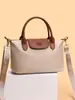 Bolsa tipo dumpling de color block de comercio exterior para mujer, nuevo modelo 2026, bolso de hombro casual versátil, bolso de mano texturizado para ir al trabajo y uso cruzado
