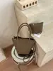 Bolso de cubo tejido estilo coreano ins súper popular transfronterizo para mujer, nuevo modelo 2026, bolso de hombro y bandolera versátil de alta gama para el día a día