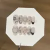 Um par de pontas de unha Gu [Sombra de Flor de Renda] transparentes, estilo chinês moderno, com flor de renda preta e branca, em formato de coração e com bolinhas, adornadas com strass, feito à mão