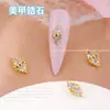 Popular en línea popular joyería para uñas chapada en oro circonita gota de agua joyería para uñas de alta gama exquisita estrella Luna diamante para uñas al por mayor