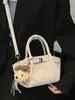 Bolsa balde tendência de nicho para carregar na mão, nova moda primavera 2026 bolsa de ombro estilo coreano, bolsa transversal de alto valor para mulheres