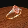 Anillo de estilo vintage color rosa-naranja padparadscha con brillo de atardecer, incrustado con diamantes de alto carbono, anillo de boda de cuerda retorcida color huevo de paloma para mujer