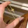Pulseira de Flor de Íris Nova Chinesa Micro-incrustada de Luxo Leve Design de Nicho Ins Laço Trevo de Quatro Folhas Pulseira Fashionável Versátil