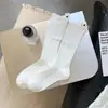 Nuevas Medias de Doble Punto Otoño e Invierno Medias de Apilamiento Maillard para Niños Corea del Sur Ins Partículas Punto Grueso Tubo Medio Etiqueta de Tela Medias de Moda