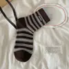 Calcetines rayados hasta la pantorrilla para mujer, calcetines holgados de algodón sin costuras, etiqueta de tela de moda estilo ins miumiu con letras, calcetines largos de otoño e invierno