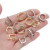 Pendientes geométricos Joker de moda transfronteriza de Europa y Estados Unidos para mujer, circonitas microincrustadas de 18 quilates con hebilla colgante para la oreja, accesorios para pendientes DIY al por mayor