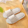 Novas pantufas de tecido de linho masculinas 2026 do fabricante para uso doméstico, pantufas internas para casal e pantufas femininas para uso em casa de aluguel, atacado