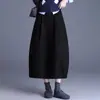 Nova saia tulipa de cor sólida de cintura alta que cobre o quadril para mulheres, moda casual outono 2026, saia guarda-chuva versátil, saia de lanterna moderna, meia-saia da moda