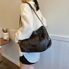 Bolsa de comércio exterior feminina 2026 outono novo versão coreana bolsa de mão de grande capacidade bolsa de ombro transversal casual simples