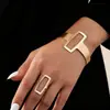 Pulsera con apertura geométrica para mujer, diseño de metal transfronterizo europeo y americano, estilo punk retro, elegante y exagerado.