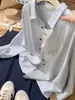 Moda Nova da Primavera e Outono de 2026 Elegante e Estiloso Caimento Solto Design Emagrecedor Redutor de Idade Lapela Elegante Manga Longa Blusa