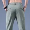 Pantalones Casuales de Hombre Verano Delgados Estilo Coreano Gama Alta Elásticos Ajustados con Cremallera Antirrobo Color Sólido Secado Rápido Pierna Recta