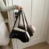 Bolso de nicho transfronterizo 2026 nuevo estilo moderno simple color liso de moda casual para el día a día un solo hombro personalidad axila cruzada mujer