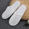 Hotel hogar Viaje Hospitalidad pantuflas desechables tema casa de huéspedes hotel pantuflas engrosadas tela al por mayor