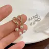 Pendientes de Borla de Perla y Circonita Dorada Aguja de Plata S925 Lujo Accesible Gama Alta Franceses Simples y Únicos Pendientes Elegantes