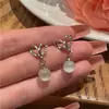 Nuevos pendientes de botón de ópalo de moda 2023 diseño de nicho femenino aguja de plata S925 pendientes de lujo ligero de alta calidad venta al por mayor