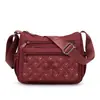 Tendência transfronteiriça nova bolsa feminina bordada multicamadas de nylon de ombro único moderna para mães no trajeto diário bolsa de ombro única feminina casual