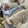 Nuevo modelo 2026 juego de ropa de cama de cuatro piezas de algodón lavado con diseño de jacquard teñido en hilo fresco y simple, adecuado para dormitorios de estudiantes y lavable a máquina