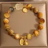 Pulsera Auténtica de Cristal Dorado Natural de Cabello Dorado Bestia Dorada Tragadora Pulsera de Cristal de Titanio Cristal Amarillo de Cabello Piedra Lunar para Mujeres para Regalar a Novias y Mejores Amigas