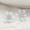 Joyería europea y americana personalidad hipster moda copo de nieve de diamante aretes pequeños de botón aretes clásicos joyería femenina venta al por mayor