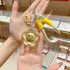 Llavero Dorado, Oro Puro 999, Colgante Flor de Dinero, Decoración para Bolso, Regalo para Evento de Promoción Empresarial Venta al por Mayor