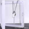 Collar de acero inoxidable de moda para hombres y mujeres cadena de suéter Sansheng III tres anillos anillo de acero inoxidable anillo entrelazado venta al por mayor