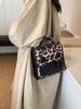 Popular transfronteriza este año bolsa de leopardo de color contrastante de nicho mochila para mujer 2024 nueva versátil bolsa de viaje