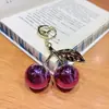 Venda Quente Transfronteiriça Luxo Leve Cor Vibrante Chaveiro Grande de Cereja Pingente Doce de Nicho para Bolsa Presente Pingente de Mochila de Menina