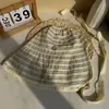Chapéu de pescador dobrável estilo celebridade primavera e verão com fita aba larga chapéu bucket faz o rosto parecer menor chapéu de tira trançada listrado versátil bucket