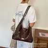 Bolso de axila tejido de nicho transfronterizo para mujer, nuevo modelo 2026, bolso de hombro tipo cubo de gran capacidad, bolso de mano estilo coreano para el trabajo