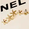 Venta directa de fábrica Yiwu aretes florales de perlas y pedrería lindos aretes de estrella de mar de tres piezas joyería para el oído al por mayor