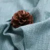 En stock poliéster imitación lino 28 Colores tela de lino grueso con recubrimiento de imitación de lino tela para bolsos suaves de primavera y verano tela decorativa de ingeniería sofá