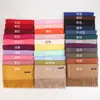 Bufanda de cachemira sintética para mujer versión coreana de otoño e invierno cálida color liso reunión anual bufanda de cachemira roja chal con flecos venta al por mayor de fábrica