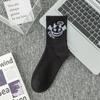 Calcetines de talla grande transfronterizos, calcetines de algodón de moda para hombre, medias de color sólido en blanco y negro, calcetines de baloncesto de primavera y verano para mujer, al por mayor