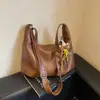 Bolsa de ombro transversal com textura de moda retrô, grande capacidade, novo design de nicho Outono/Inverno 2026, bolsa para o dia a dia, bolsa de bolinho