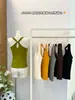 Moda de principios de otoño, nuevo top sin mangas de chica popular con espalda cruzada y almohadilla para el pecho integrada con proteína de seda, tela elástica, tirantes finos 5202