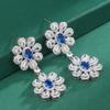 Pendientes de margaritas pequeñas para mujer, nuevos pendientes europeos y americanos con microincrustaciones de circonitas rojas, amarillas y azules, estilo vintage de la industria pesada.