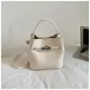 Bolso de Mano Pequeño Vintage para Mujer 2026 Nuevo Estilo Coreano Bolso Cubo de Nicho Bolso de Hombro Cruzado de Moda para el Trabajo Tendencia