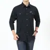 Camisa de algodón de manga larga para hombre de primavera y otoño, ropa de trabajo lavada para hombre de mediana edad al aire libre, camisa lisa suelta, fabricante de ropa para hombre