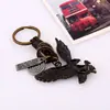 Llavero creativo para hombre y mujer, pequeño regalo de aleación de bronce, águila, llavero vintage de piel de vaca tejida, colgante de cuero